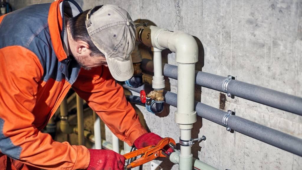 Professional plumber technician at work